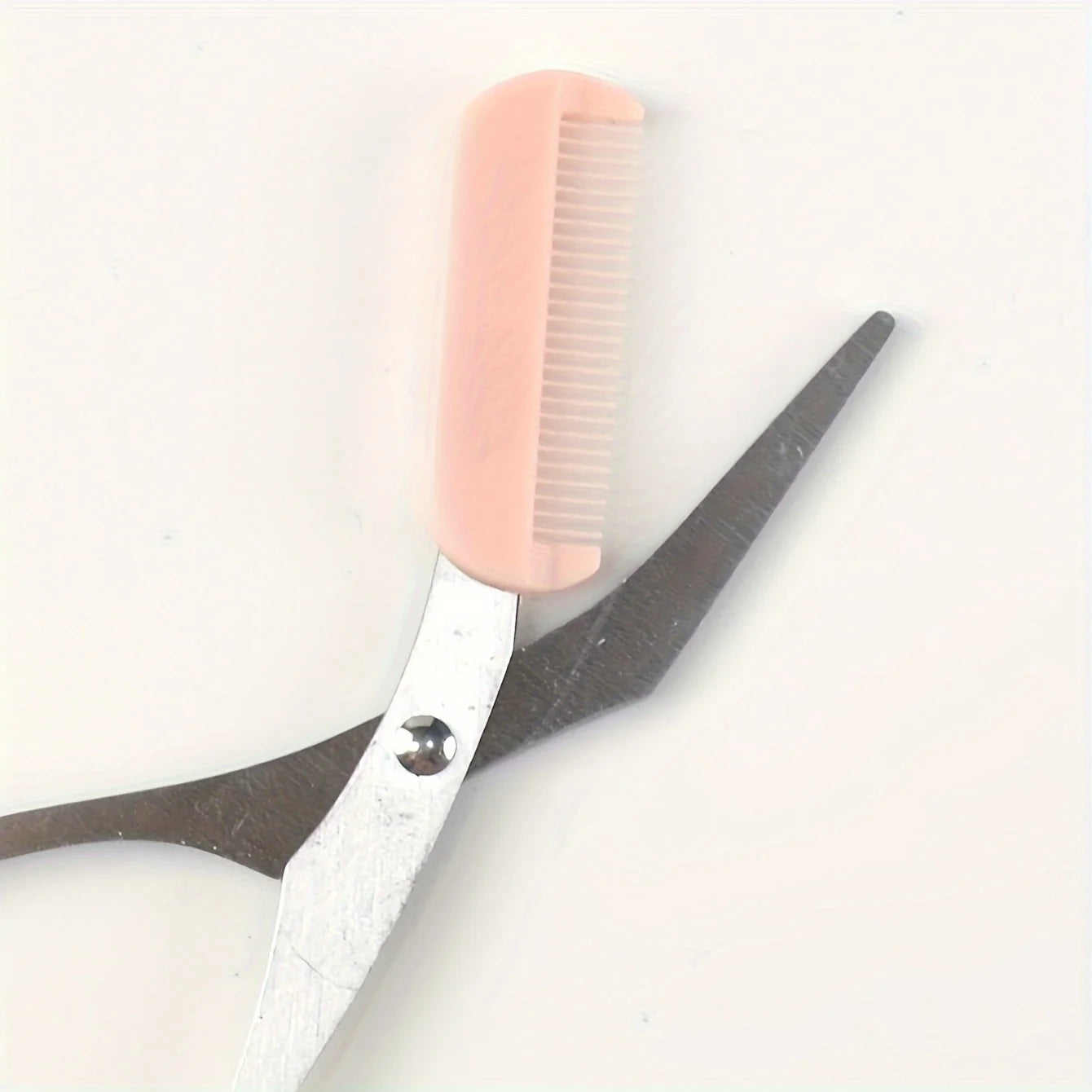 Pink eyebrow trimming scissors with built-in comb - stainless